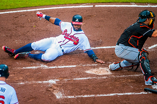 Braves player sliding into home