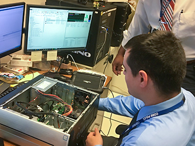officer examining computer